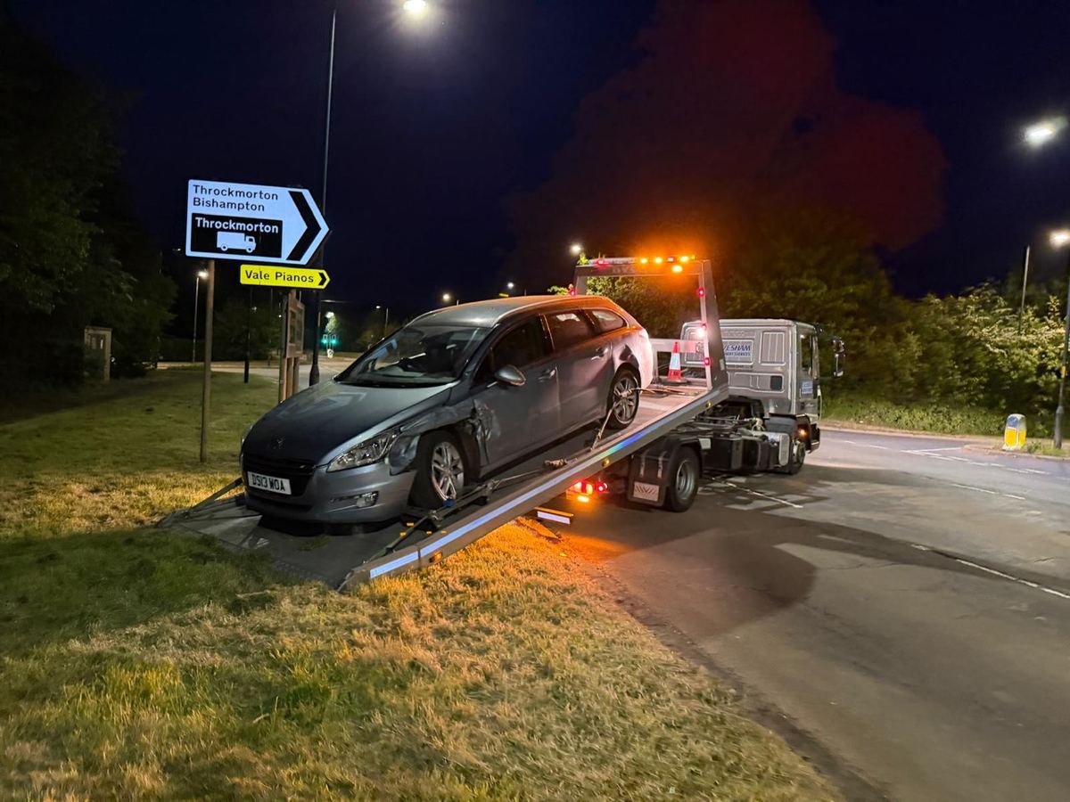 Recovering an accident-damaged car at night under our beacons